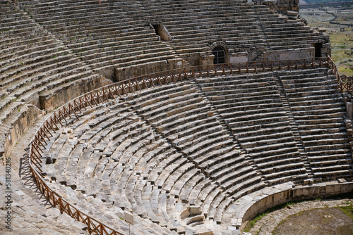 Ruins of theater in ancient Hierapolis now Pamukkale Turkey. Amphitheater (Coliseum) in ancient city Ephesus, Turkey in a beautiful summer day photo