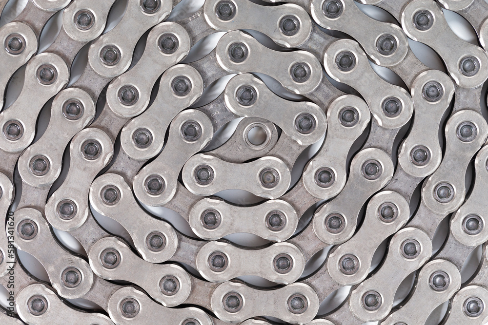Extreme Closeup Image of New Clean Oiled Twisted Circled Bicycle Chain Isolated Over White Extreme Closeup Image of New Clean Oiled Twisted Circled Bicycle Chain Isolated Over White