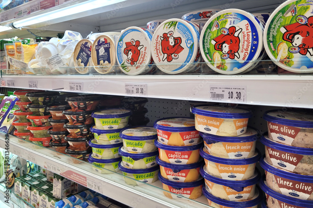 PENANG, Malaysia 15 Mar 2023 Huge open fridge with various dairy products imported cheese in