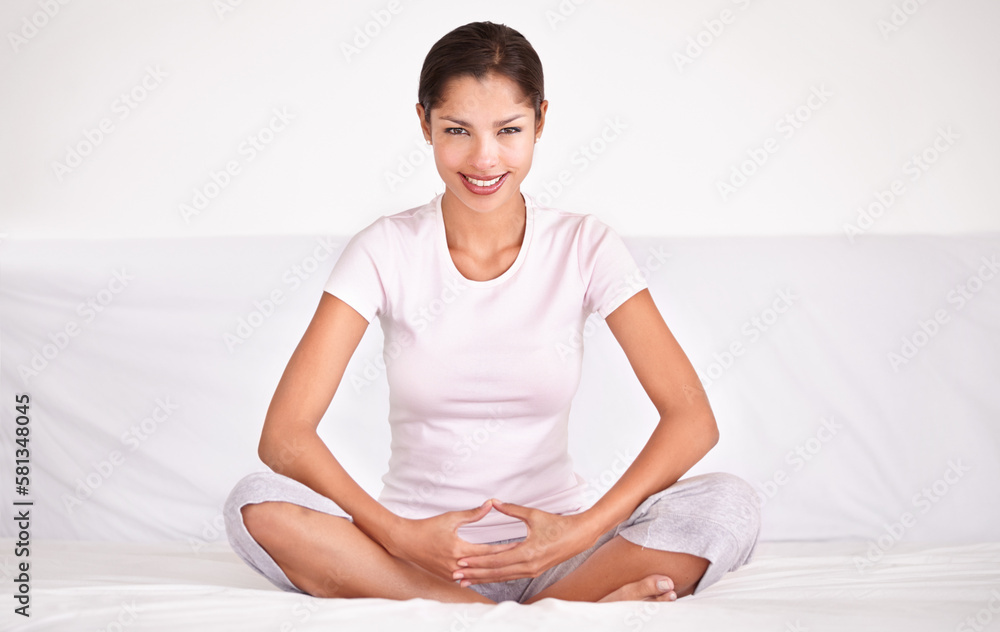 Finding her spiritual center. A young woman sitting crossed legged and meditating. Finding her spiritual center. A young woman sitting crossed legged and meditating.