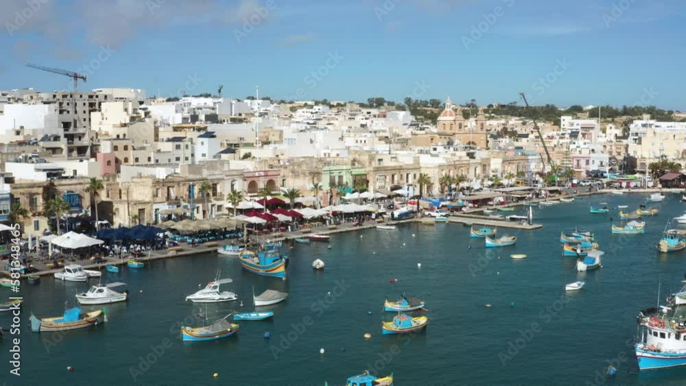 Aerial View Of Marsaxlokk Harbour With Colorful Boats In Malta Bay. Aerial View Of Marsaxlokk Harbour With Colorful Boats In Malta Bay.