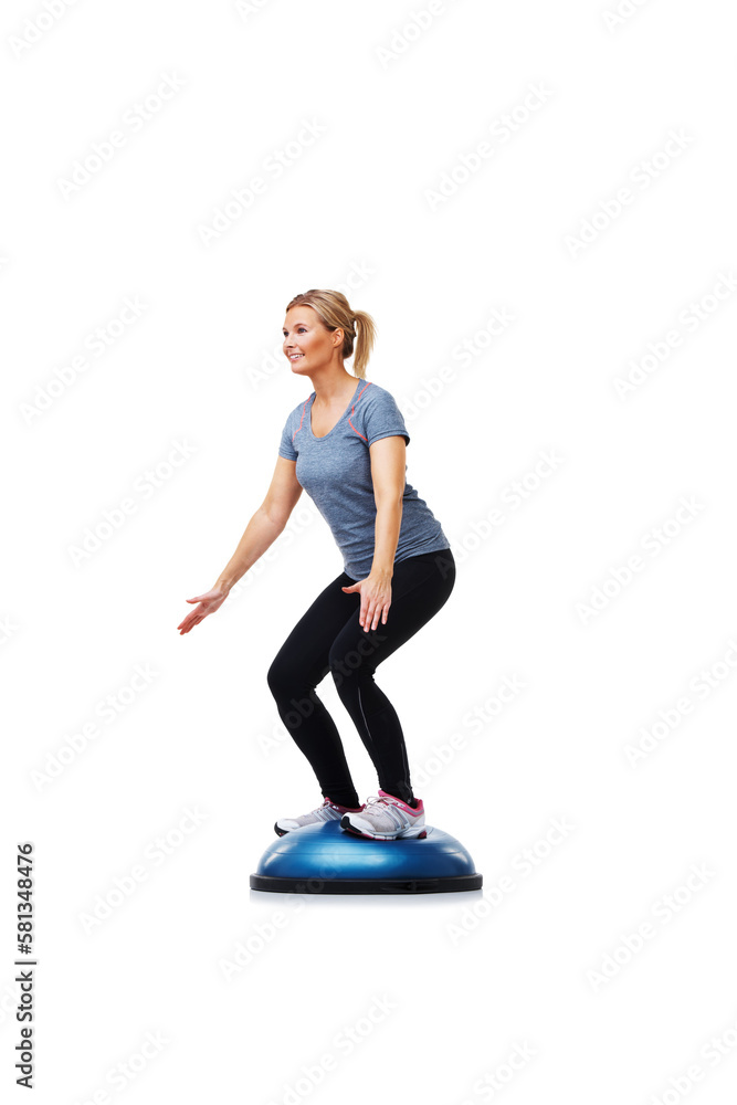 Her daily workout. A beautiful young woman standing on a bosu-ball while working out. Her daily workout. A beautiful young woman standing on a bosu-ball while working out.