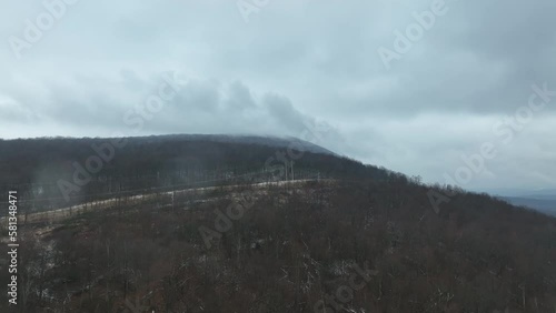 Drone flight approaching mountain in the winter. photo