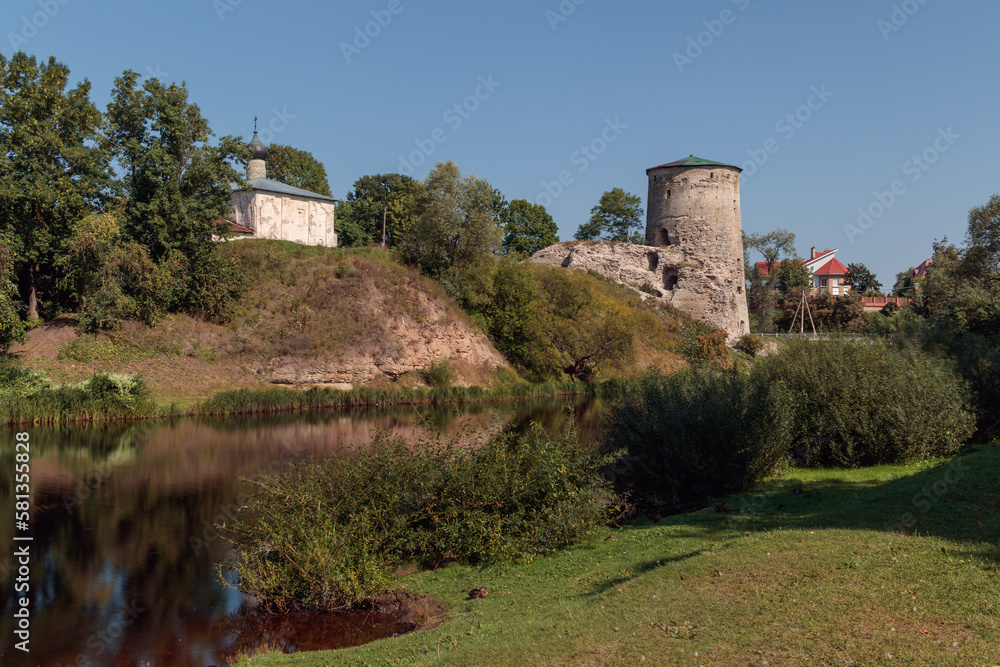 Gremyachaya fortress tower and the ancient Church of Kozma and Damian in Pskov.