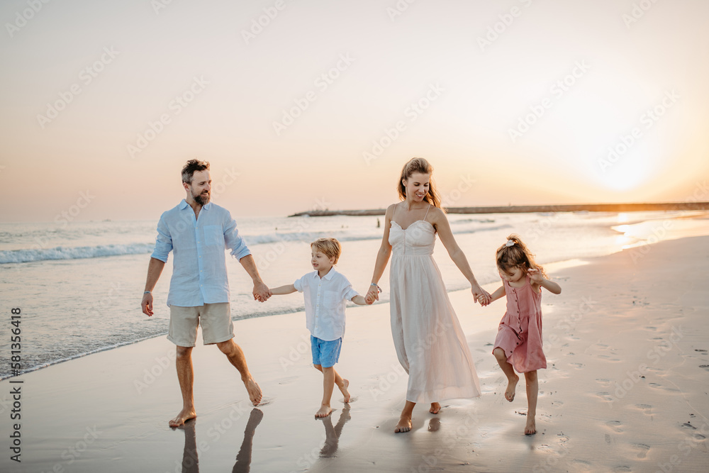 Happy family with little kids enjoying time at sea in exotic country. Happy family with little kids enjoying time at sea in exotic country.