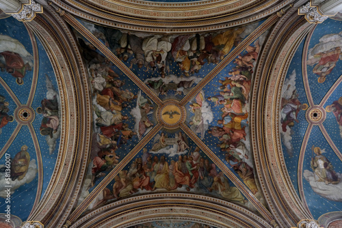 Monumental church building in Gothic in neo-romanesque arch style with large ceiling and altar murals and fresco  opulent detailed columns and marble structures