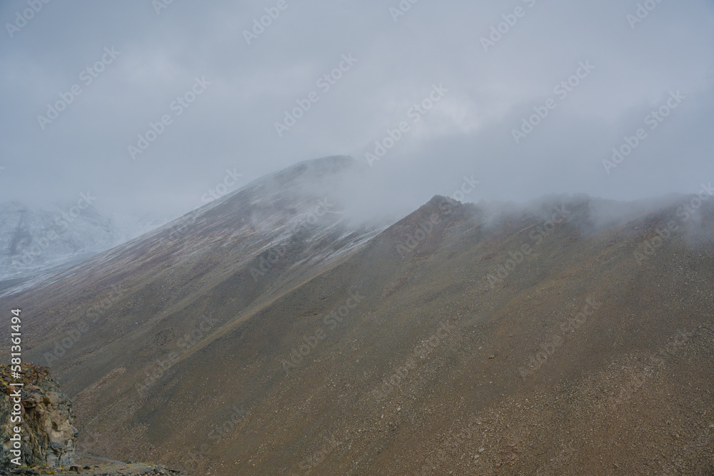 rolling hills and clouds on the top of the mountain at Ladakh, Leh, India rolling hills and clouds on the top of the mountain at Ladakh, Leh, India