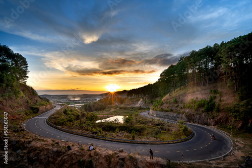 Sunset in Ta Nung Pass in Da Lat City, Vietnam. The winding road in the distance is Da Lat city photo