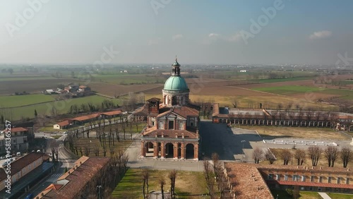 A stunning drone circling shot captures the beautiful Lombardy region's Santuario di Caravaggio, an iconic Italian pilgrimage site. photo