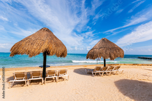 Tropical paradise beach with white sand and coco palms travel tourism wide panorama background. Luxury vacation and holiday, tropical beach resort concept. Beautiful beach design in cancun, mexico