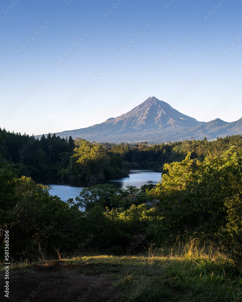 Fototapeta premium Morning view of Mt Taranaki from Lake Mangamahoe, New Plymouth. Vertical format.