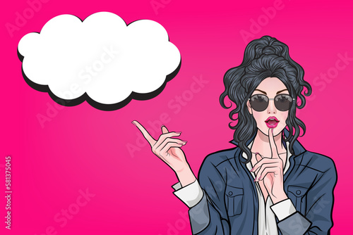 Beautiful sexy girl in glasses with speech bubbles opens her mouth and points up.