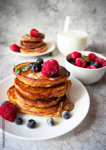 Pancakes with berries. breakfast. On a concrete background