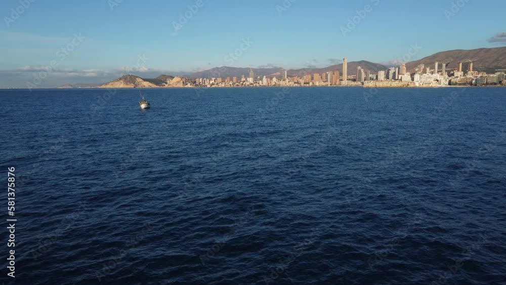 Aerial approach to the picturesque tourist city of Benidorm, Spain Aerial approach to the picturesque tourist city of Benidorm, Spain