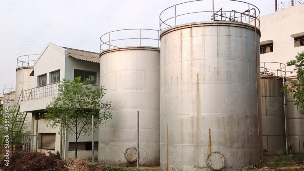 A view of industrial storage tanks at a soap manufacturing factory A view of industrial storage tanks at a soap manufacturing factory