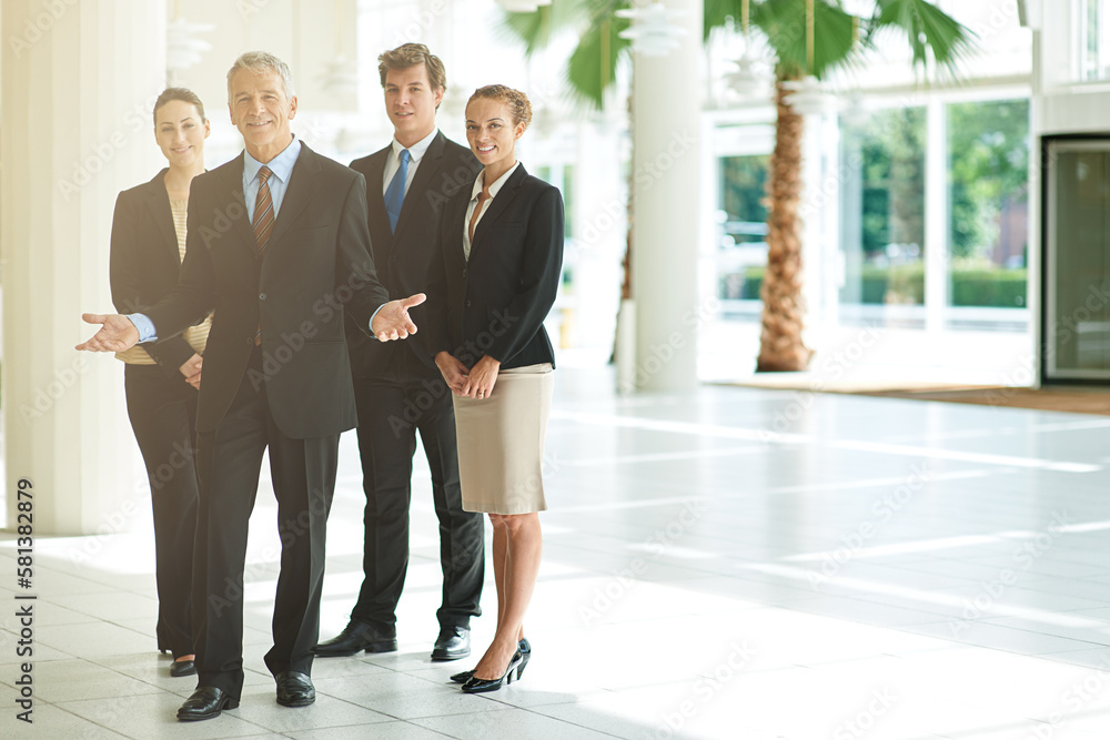 Fototapeta premium You called for the best You got it. Portrait of a group of businesspeople standing together in an office lobby.
