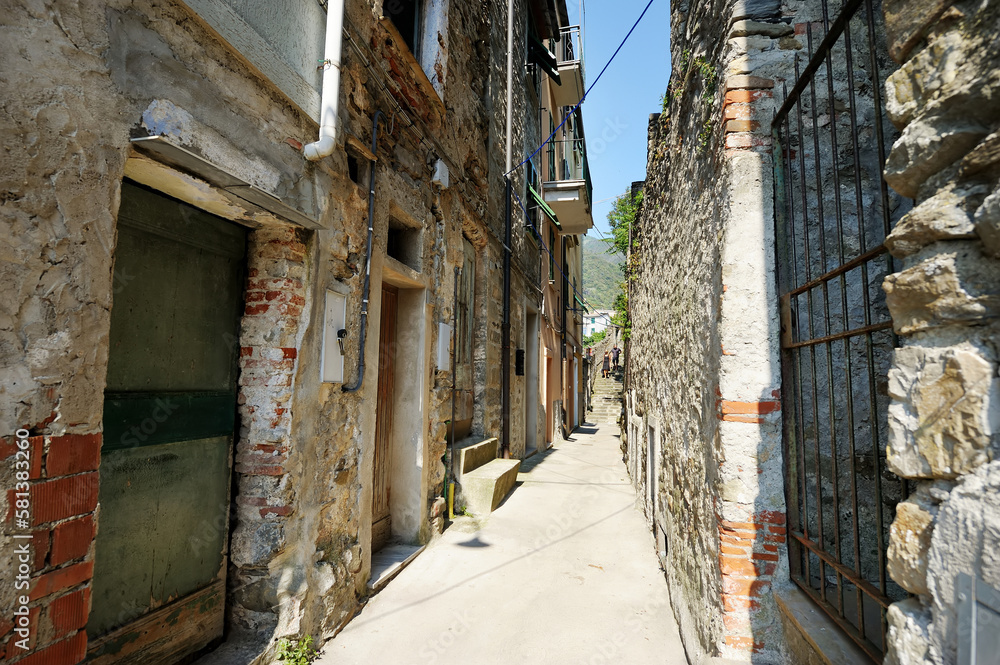 Narrow streets of Corniglia, located on rugged northwest coast of Italian Riviera, Liguria, Italy.