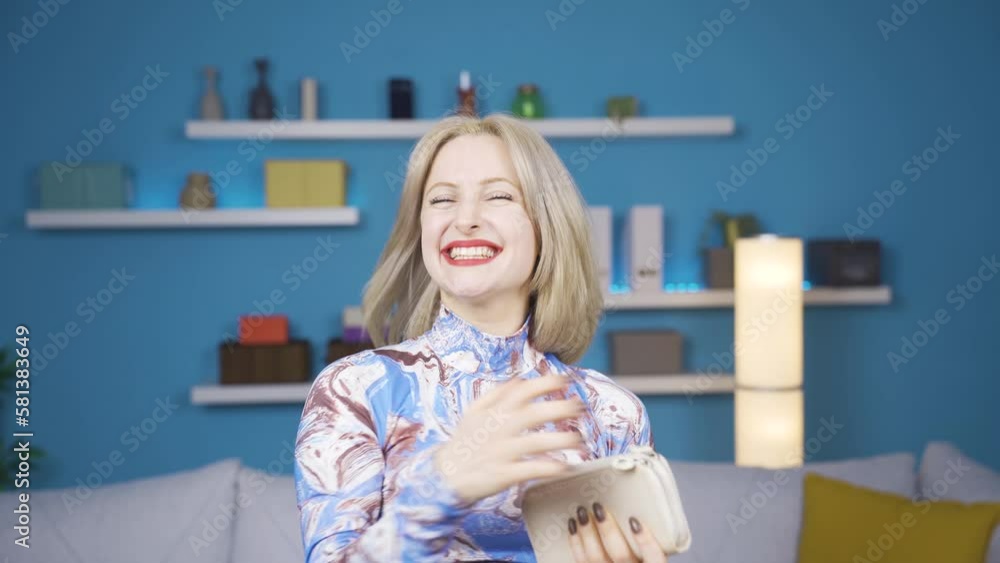 Happy young woman who likes to use credit card.
Cute young woman taking out a credit card from her wallet is happy and delighted.
