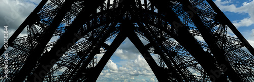 Eiffel Tower against the background of a beautiful sky with clouds. Paris, France #581383844