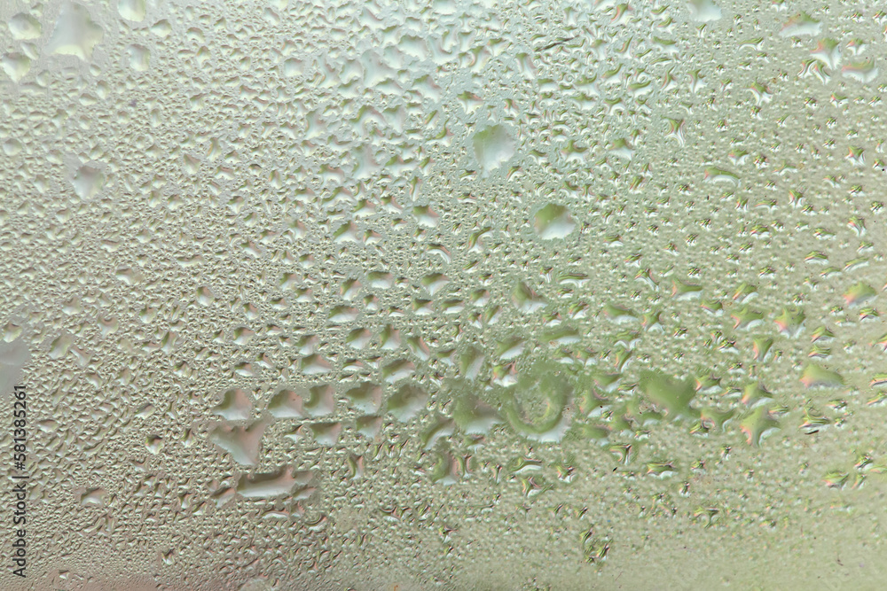 Water drops on a window, textured background, pastel colors, defocused Water drops on a window, textured background, pastel colors, defocused