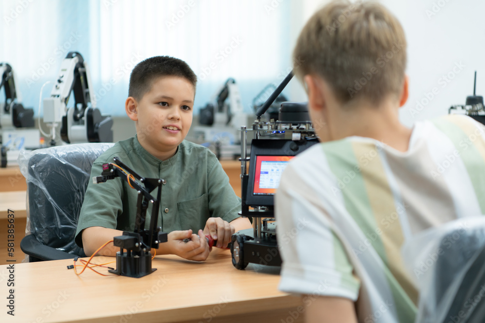 Children using the hand robot technology, Students are studying technology, which is one of the STEM courses. Children using the hand robot technology, Students are studying technology, which is one of the STEM courses.
