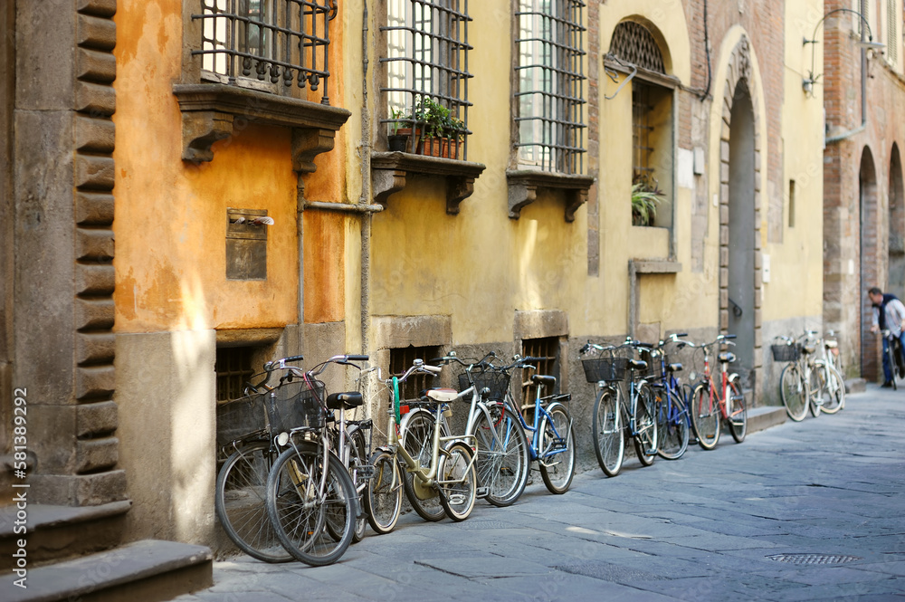 Bicycles parked on beautiful medieval streets of Lucca city, Tuscany, Italy. Bicycles parked on beautiful medieval streets of Lucca city, Tuscany, Italy.
