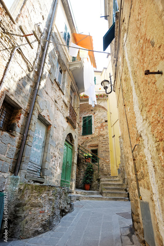 Narrow streets of Manarola, located on rugged northwest coast of Italian Riviera, Liguria, Italy. © MNStudio