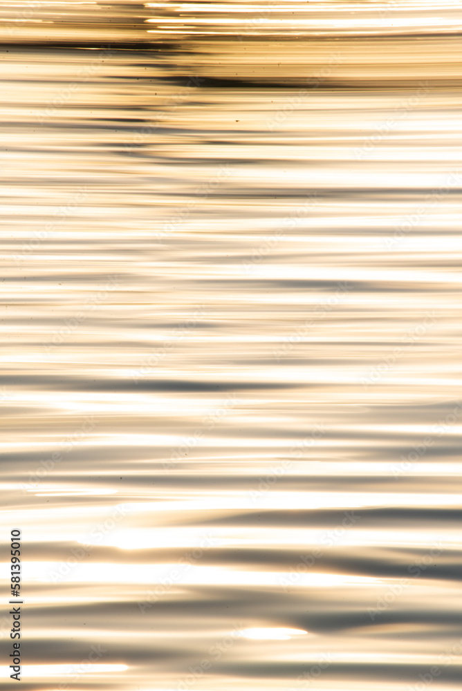 Abstract photo of water and sunrise, liquid gold Abstract photo of water and sunrise, liquid gold