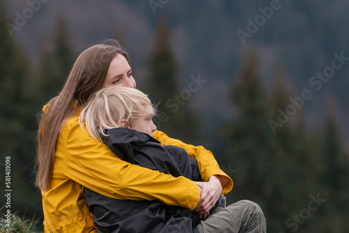 Canvastavla Portrait of young mom and son outside