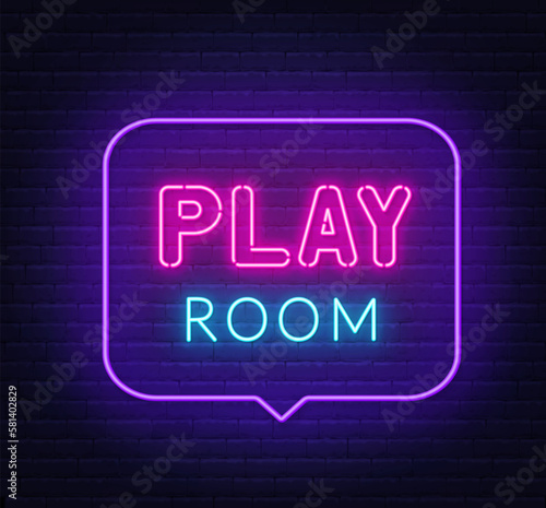 Play Room neon sign in the speech bubble on brick wall background.