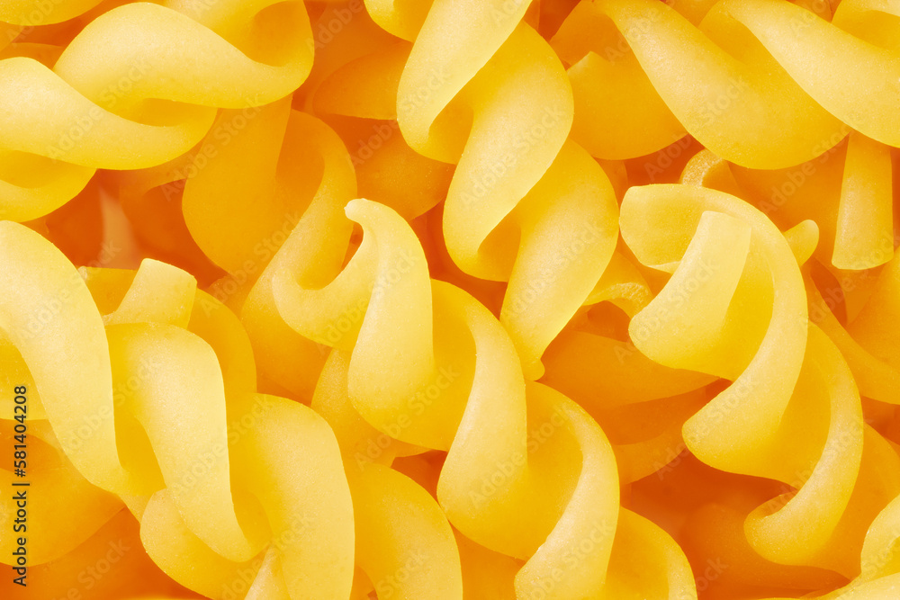 Spiral uncooked pasta in close-up Spiral uncooked pasta in close-up