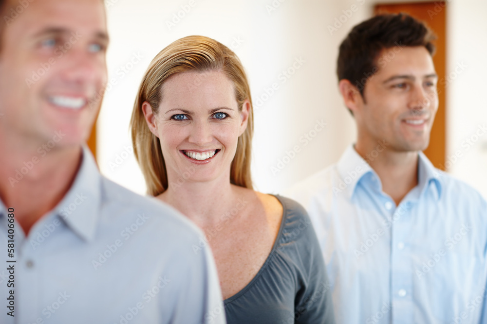 Rose amongst the thorns. three colleagues standing in the office. Rose amongst the thorns. three colleagues standing in the office.
