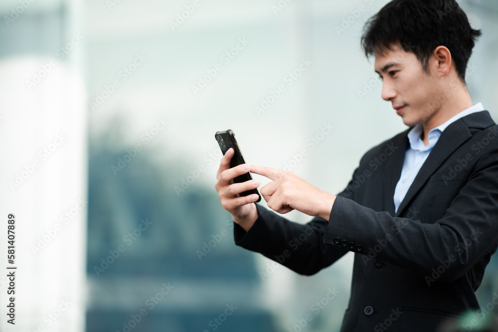 Businesswoman s hands typing on smartphone and laptop keyboard in morning light computer, typing, online in outside office. Businesswoman s hands typing on smartphone and laptop keyboard in morning light computer, typing, online in outside office.