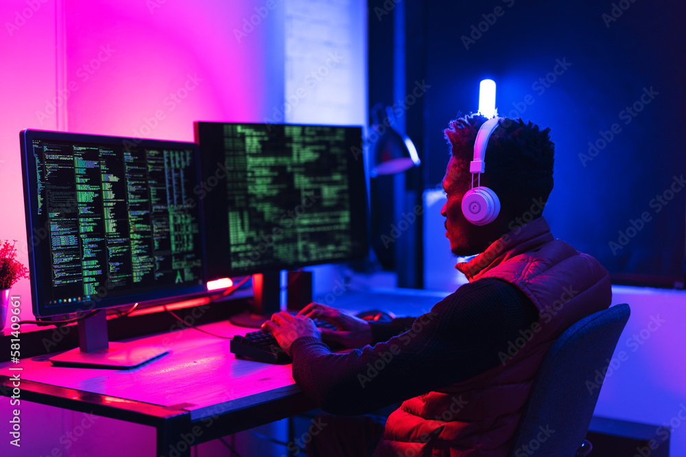 Software developer coding on his computer. Coding and hacking concept.. Software developer coding on his computer. Coding and hacking concept..