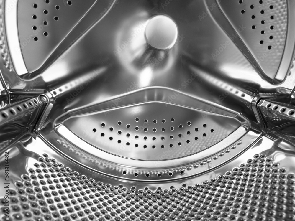 Washing machine drum close up. Washing machine background. Inside the