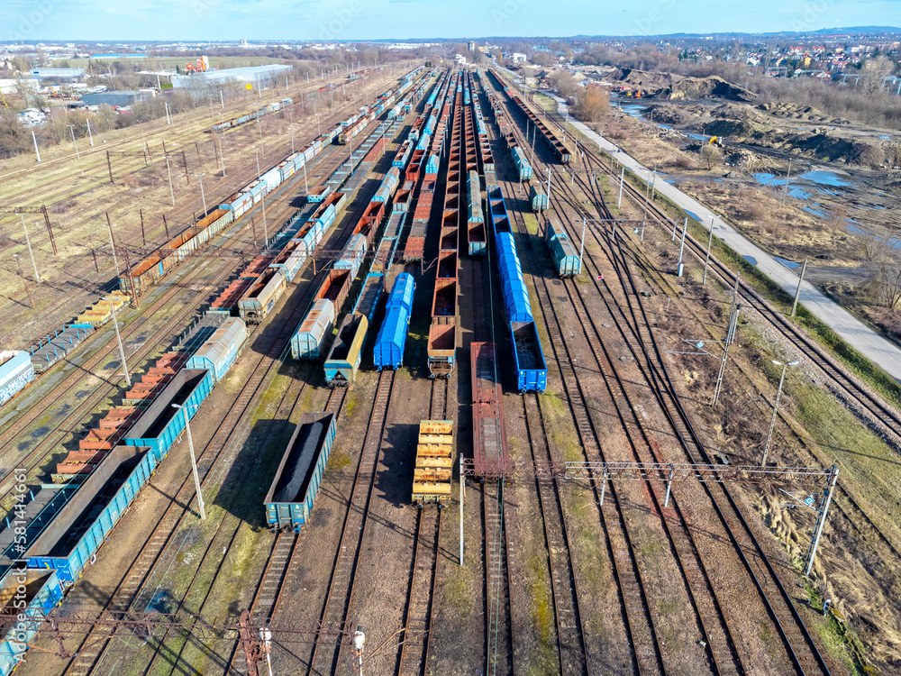 Aerial view landscape. View of railroad tracks and trains, wagon, cargo.