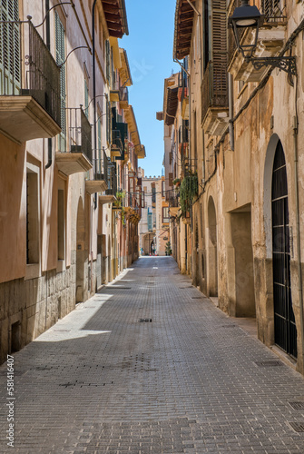 Traditional Narrow street in the old town of Palma de Mallorca, Spain © UlyssePixel
