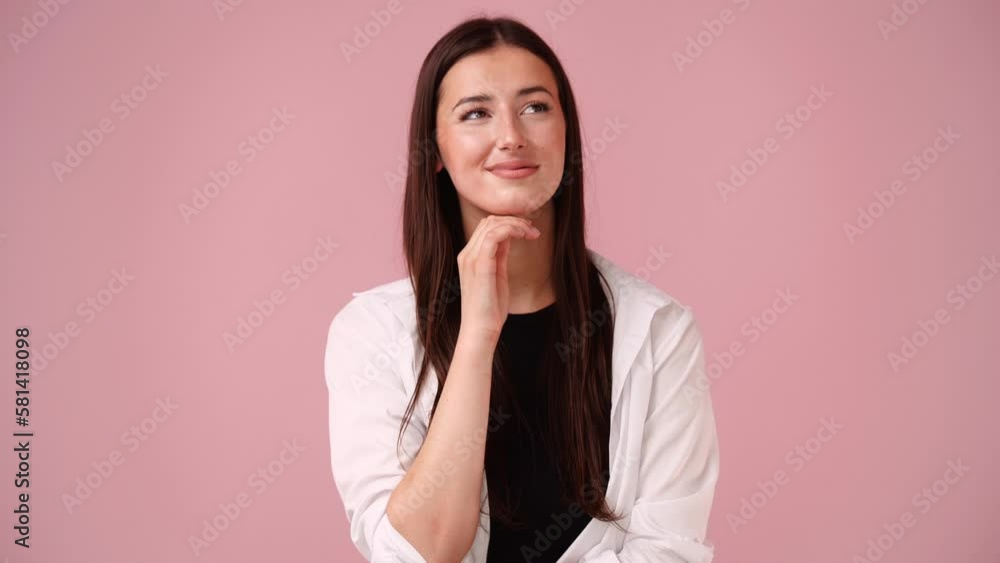 4k video of girl with thoughtful facial expression on pink background. 4k video of girl with thoughtful facial expression on pink background.