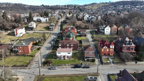 Aerial truck shot of homes and houses in rundown poor neighborhood in American town. Establishing shot of working class housing in America.