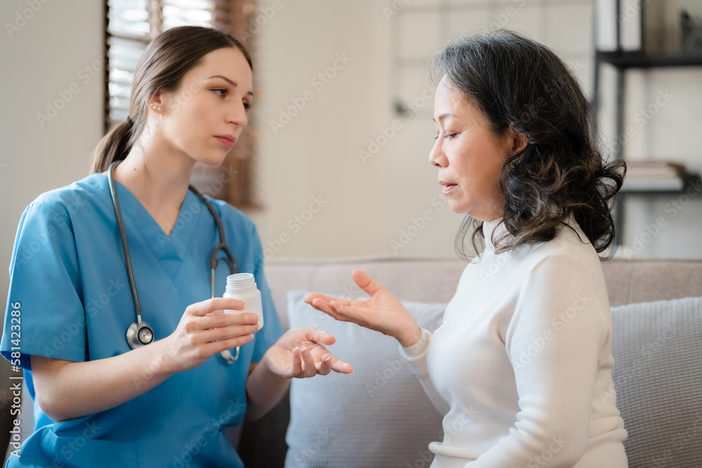 female therapist gives medication advice to an elderly patient. female therapist gives medication advice to an elderly patient.