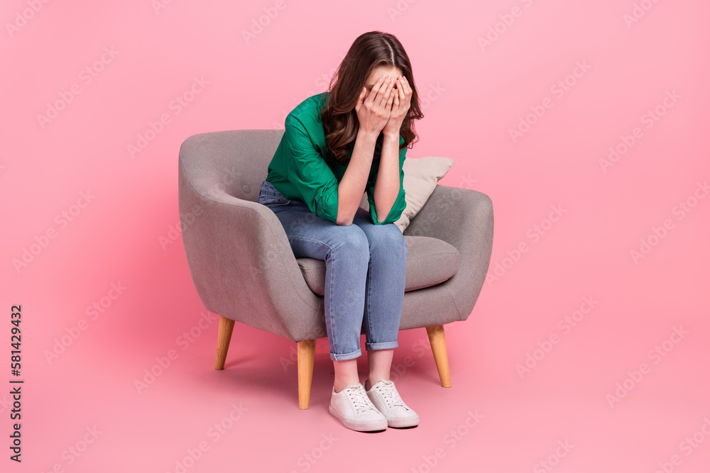 Full length photo of crying tired woman wear green shirt sitting couch arms close eyes isolated pink color background - obrazy, fototapety, plakaty 
