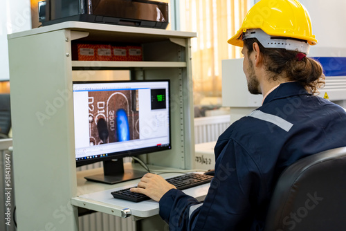 Industrial factory employee working in metal manufacturing industry