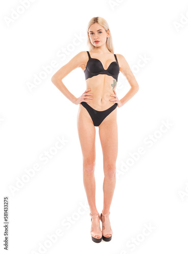 Full body portrait of a young beautiful blonde woman © Andrey_Arkusha