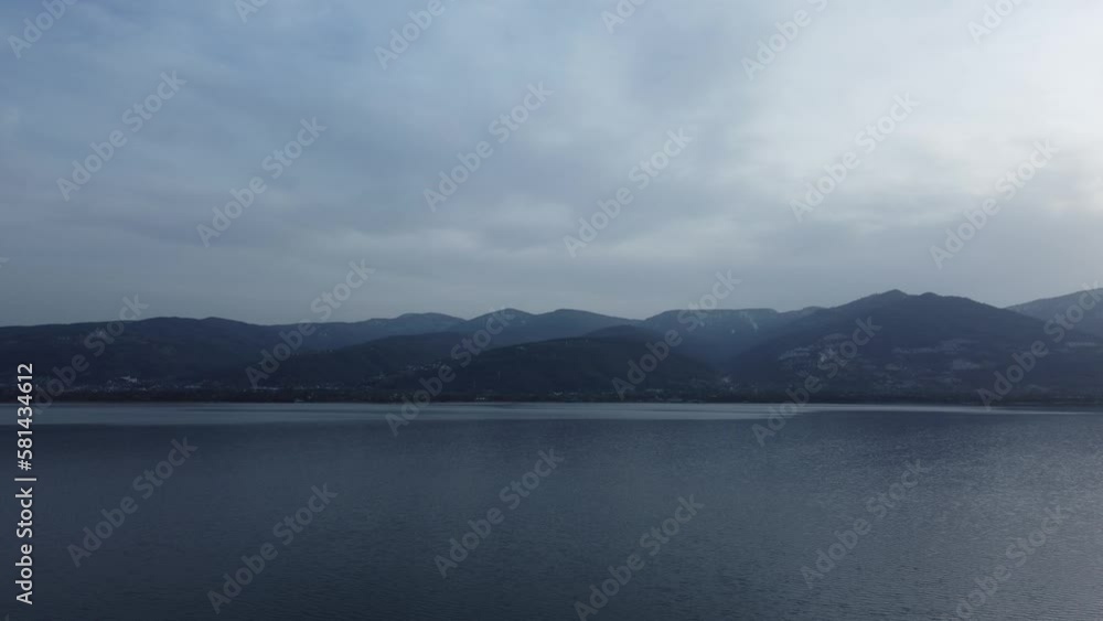 Lake landscape on a cloudy day. Drone view of a lake and mountains. Tranquil nature view. Sapanca golu or Sapanca Lake in Sakarya, Turkey. Lake landscape on a cloudy day. Drone view of a lake and mountains. Tranquil nature view. Sapanca golu or Sapanca Lake in Sakarya, Turkey.