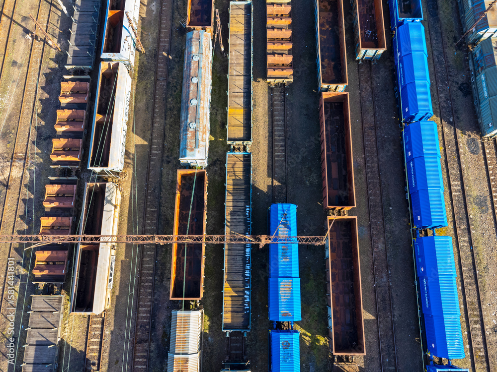 Aerial view landscape. View of railroad tracks and trains, wagon, cargo.