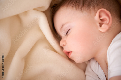 He always naps after feeding. an adorable baby boy taking a nap.