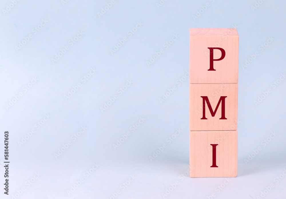PMI on wooden cubes on a blue background PMI on wooden cubes on a blue background
