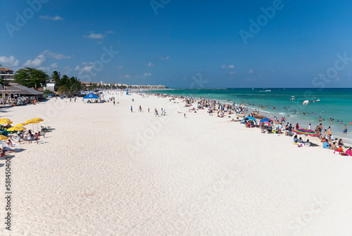 Fototapeta Naklejka Na Ścianę i Meble -  Panoramic view from above of tourists at the beach and sea on a sunny summer day in Playa del Carmen Mexico