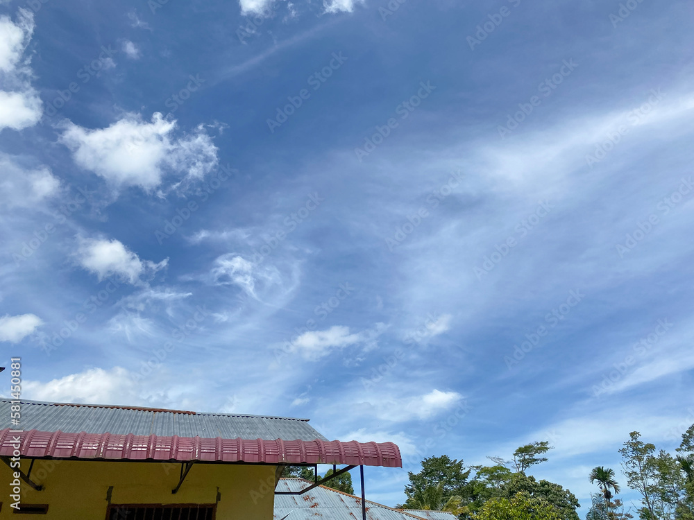 Full frame cloudy Blue sky view at day in a village. Full frame cloudy Blue sky view at day in a village.