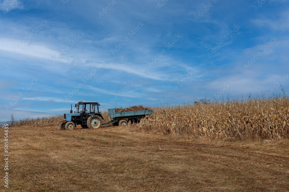 Farm tractor plowing field in a beautiful autumnal landscape. Farm tractor plowing field in a beautiful autumnal landscape.
